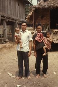 Lao men holding their sons