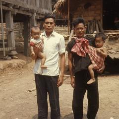 Lao men holding their sons