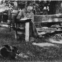 Aldo Leopold writing at the shack with Gus