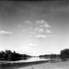 Aldo Leopold and unidentified person swimming in river