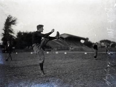 Taudberg kicking football