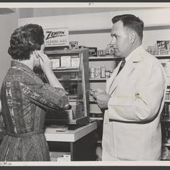 Woman tries out a hearing aid