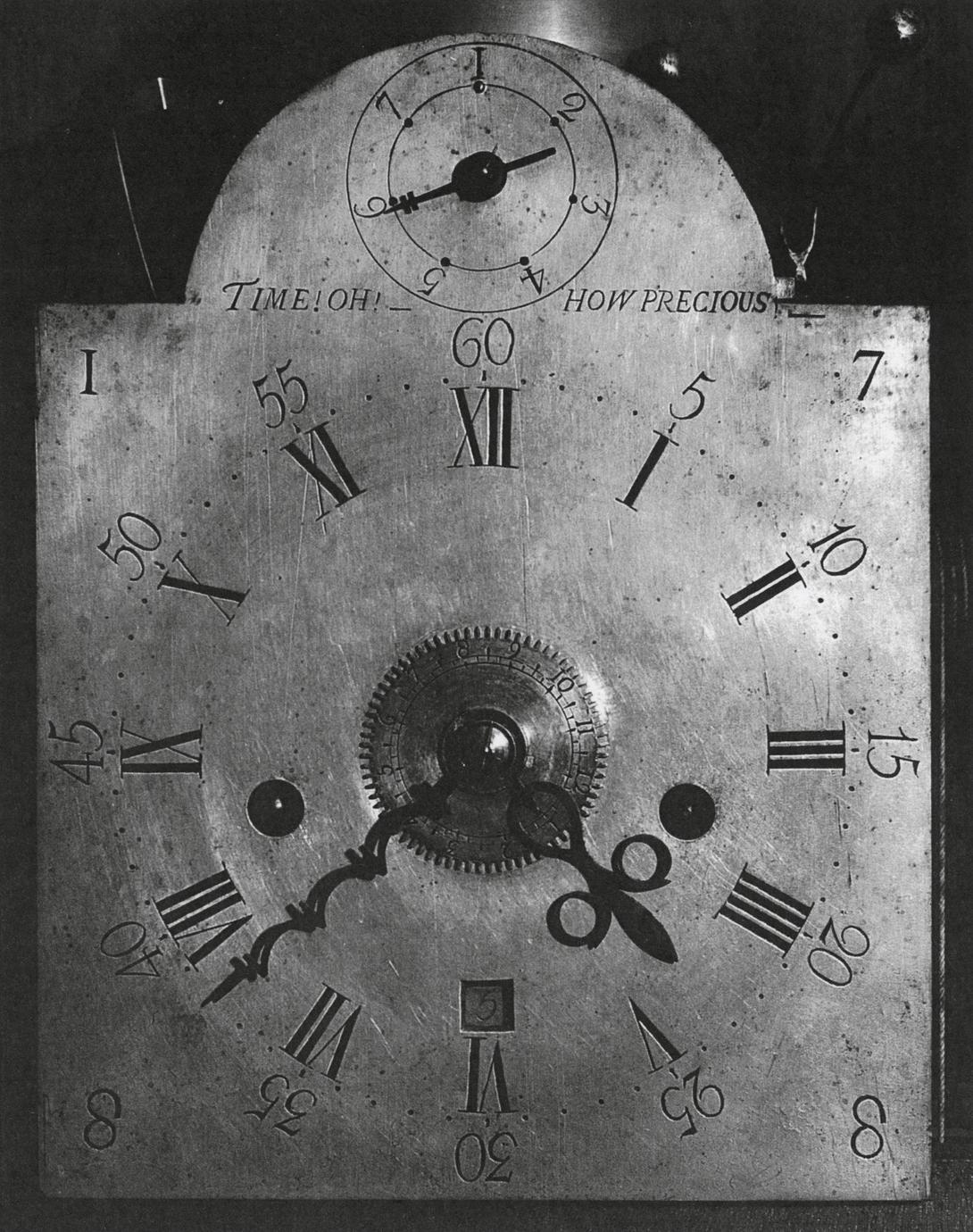 Black and white photograph of an eight-day, strike, repeater, alarm clock.