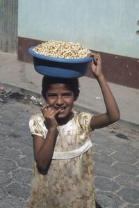 Local girl with kernels of boiled corn, Chiquimula