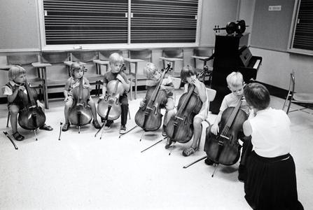Children with cellos