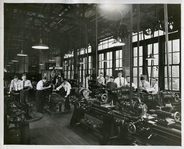 Metallurgy Club working in a machinery workshop