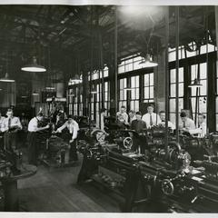 Metallurgy Club working in a machinery workshop