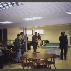 Students playing pool, studying and interacting in the student union