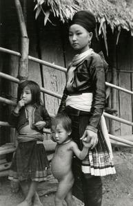 A Blue Hmong (Hmong Njua) mother and her children pose in a village in the area of Muang Vang Vieng in Vientiane Province