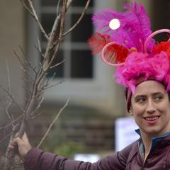 Person in pink feather hat