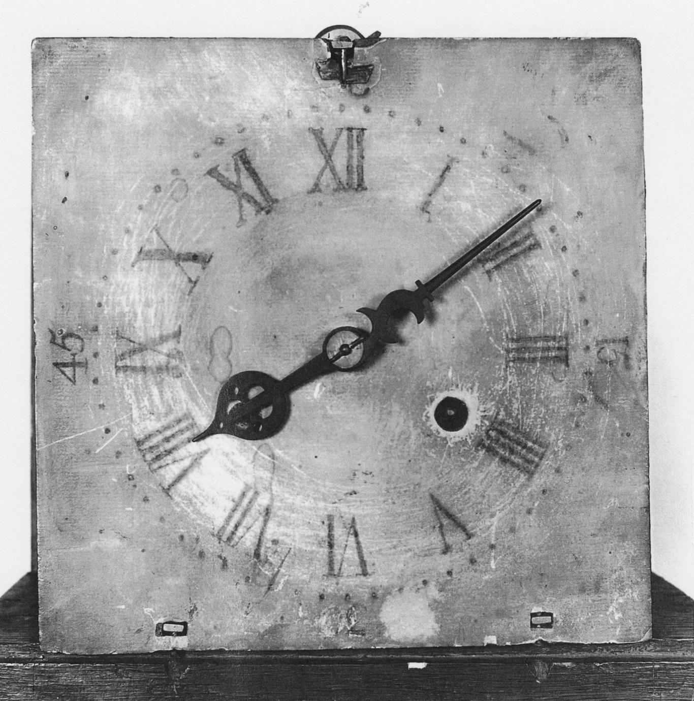 Black and white photograph of a tall-case clock.