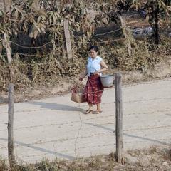 Woman carrying baskets