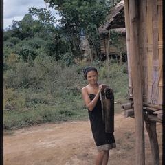 Lao girl carrying water