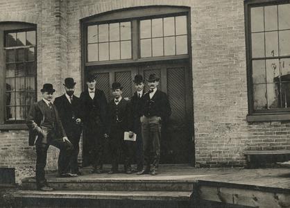 Chicago Brass Company employees outside the machine shop
