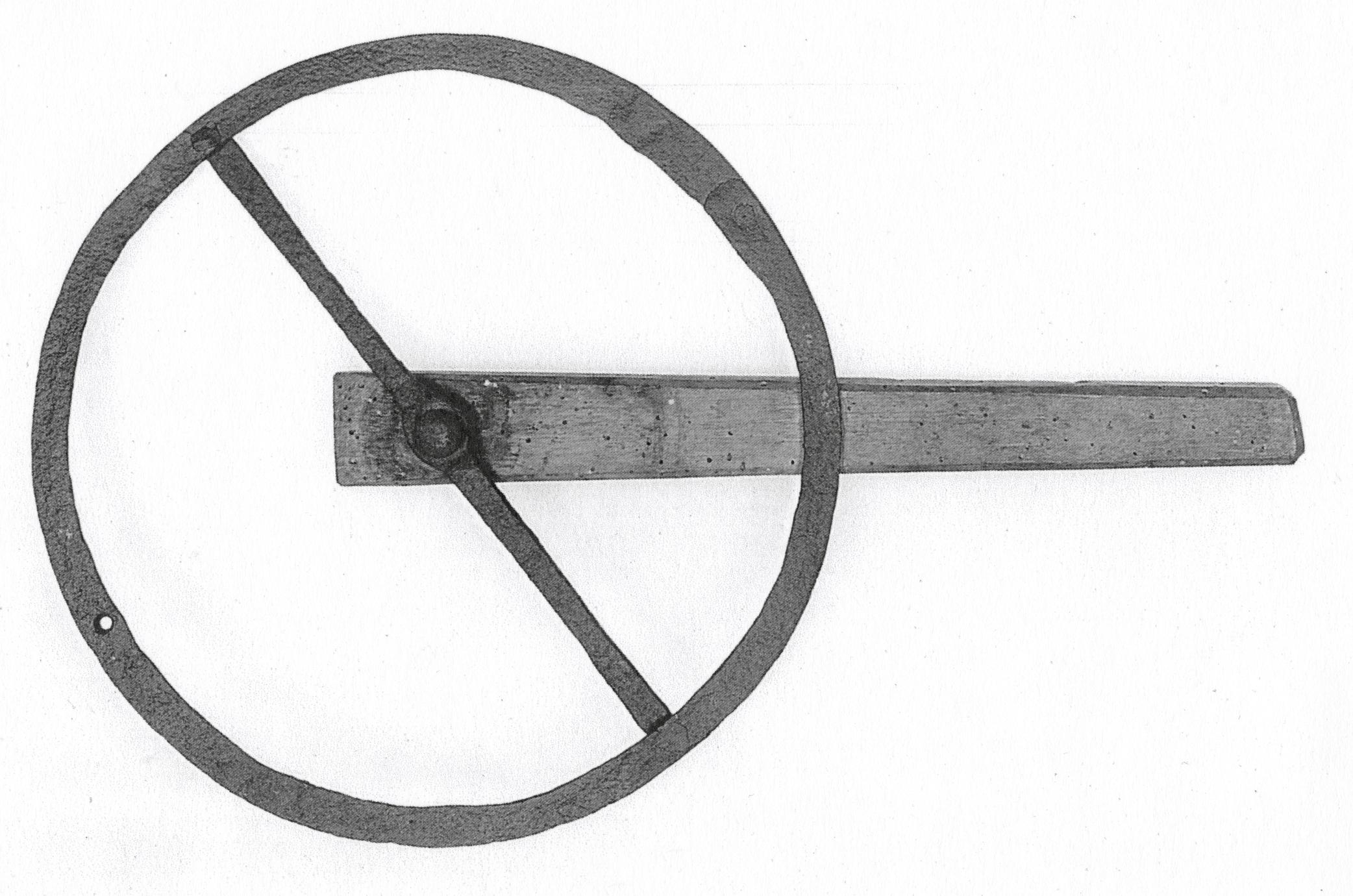 Black and white photograph of a traverse wheel or traveler.