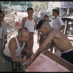 Men making funeral "house"