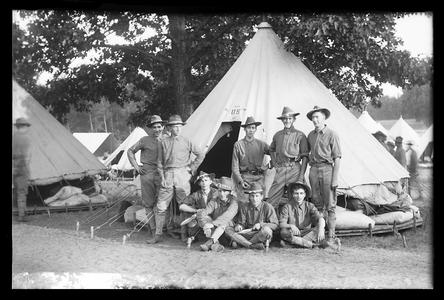 Soldiers in front of military tent camp