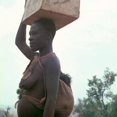 Woman with Baby on Back and Load on Head