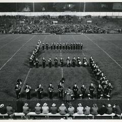 Stout Band forming the letter "S" on the football field during "Salute to the Dads," Homecoming football game, 1951