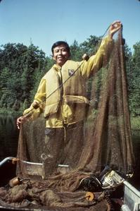 Liao Gouzhang holding a fyke net