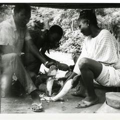 Ogun family preparing cassava