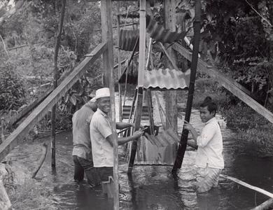 Construction of a waterwheel by villagers in the Houei Kong Cluster in Attapu Province