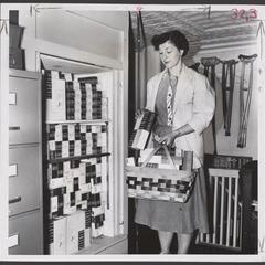 A salesclerk unloads boxes of Kleenex brand of tissue from a stock elevator