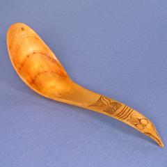 Object 1 titled Horn spoon with carved animal face on handle