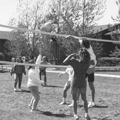 Students playing volleyball near student housing