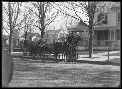 E. Bain, team and carriage, front of house