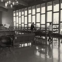 Students moving furniture in student lounge, Manitowoc, spring 1966