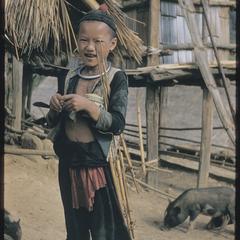 Hmong (Meo) boy with bird traps
