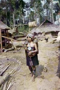 Akha woman carries water to the village in Houa Khong Province