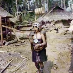 Akha woman carries water to the village in Houa Khong Province