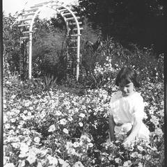 [Girl in flower garden]