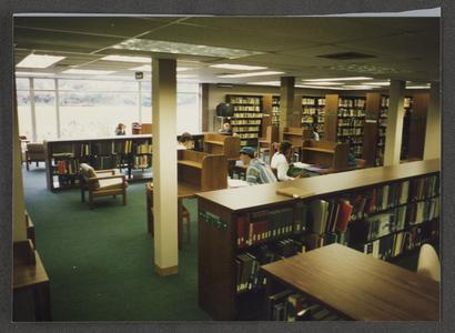 Back portion of the library with students studying