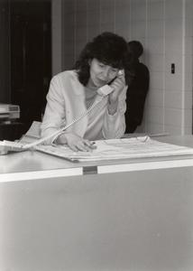 Jean Rogers at her desk