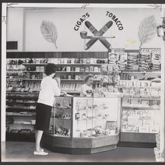 A customer views merchandise at the tobacco counter of a drugstore
