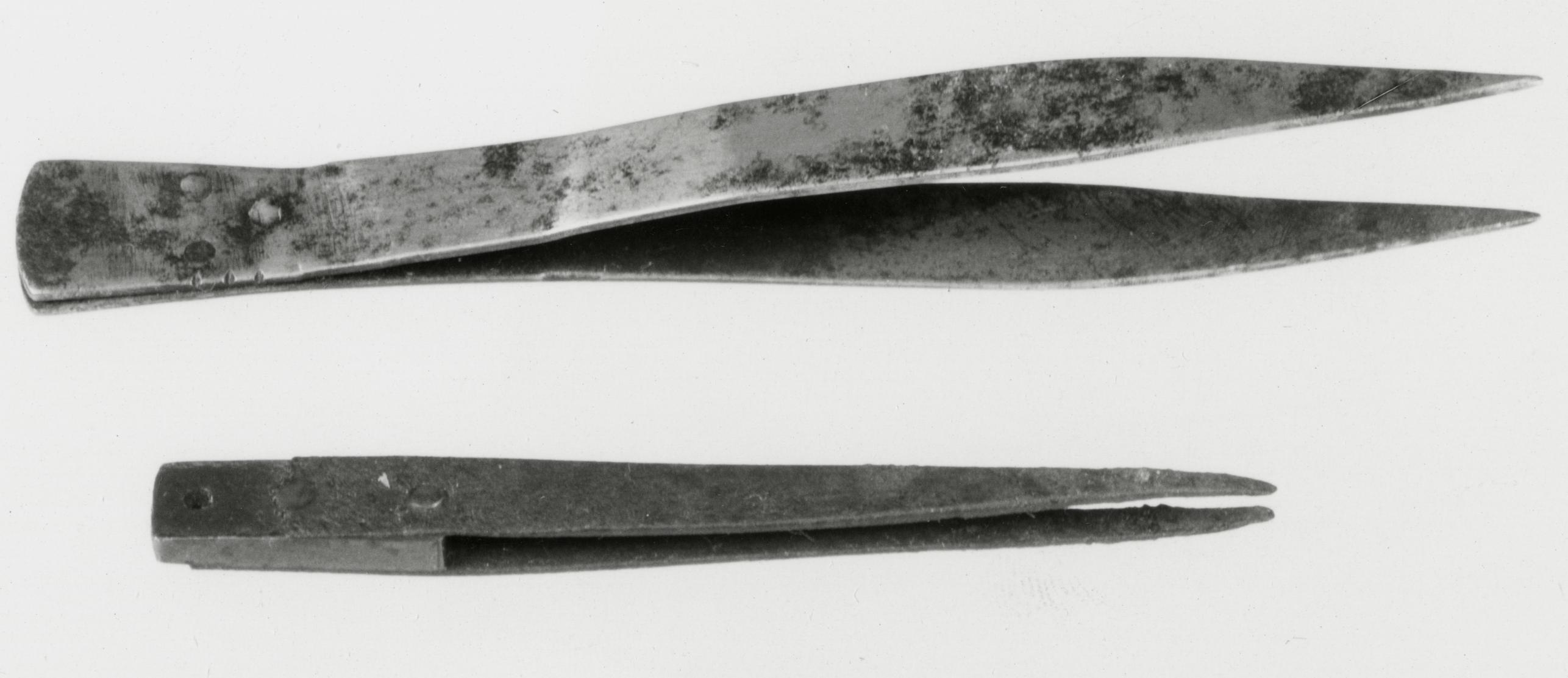 Black and white photograph of clock- and watchmaker's tweezers.