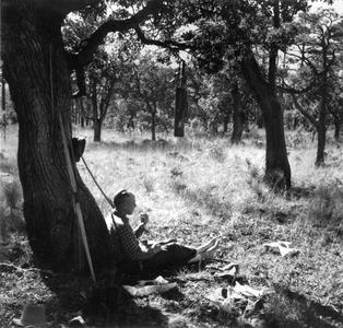 In camp relaxing with a smoke, Chihuahua, Mexico, January 1938