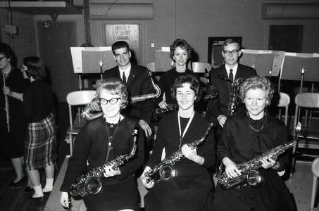 Student musicians, seated with saxophones