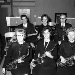 Student musicians, seated with saxophones