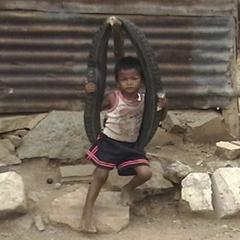 Kid on a tire swing