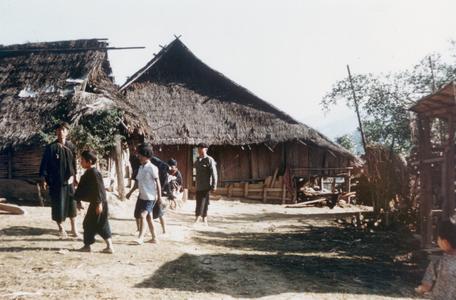 Yao (Iu Mien) youth walking in a village in Houa Khong Province