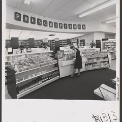 A customer shops for items in the prescription department of a drugstore