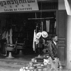 Chinese barber shop, goods displayed from adjoining store
