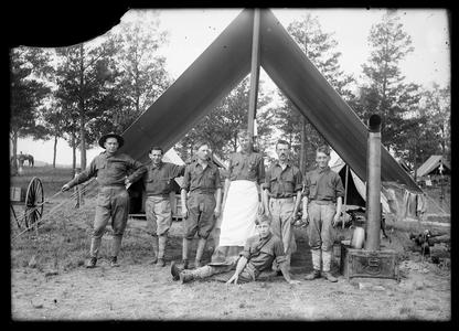 Cooks in front of military mess tent