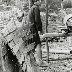 Akha woman preparing bamboo mats in the village of Phate in Houa Khong Province