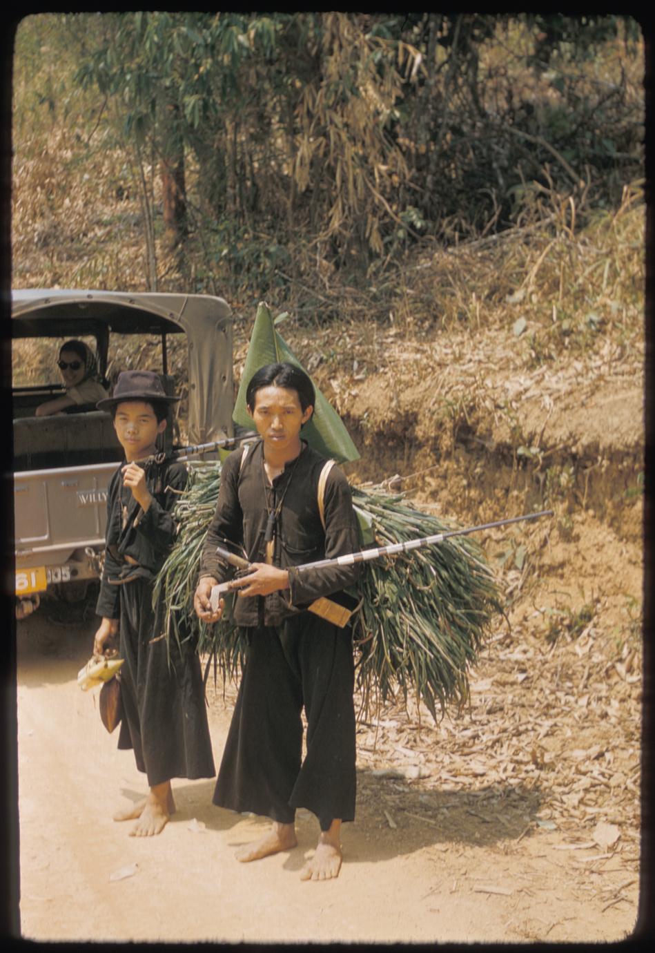 Hmong (Meo) with load of grass