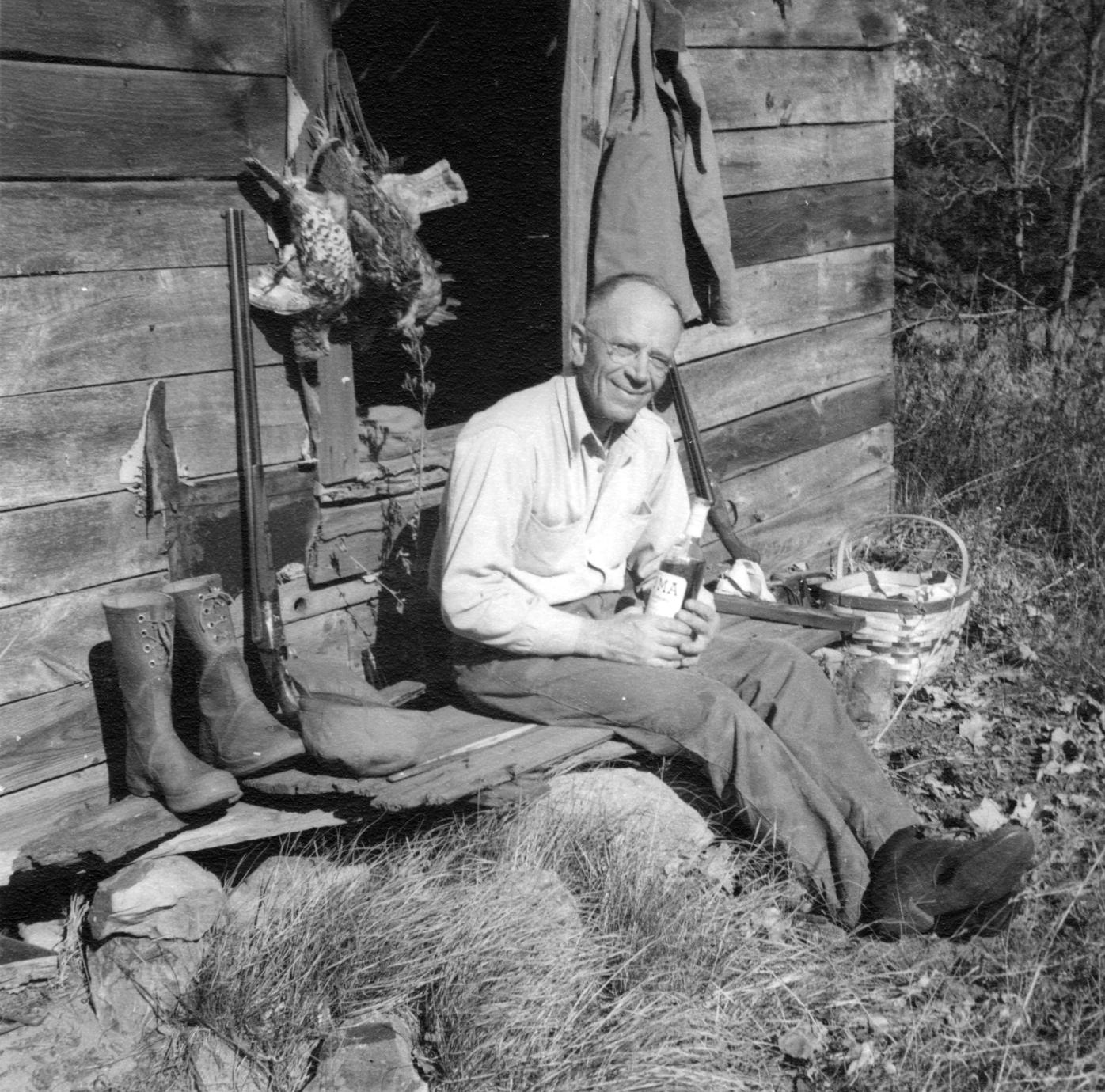 ‎Aldo Leopold with bottle and kill UWDC UWMadison Libraries